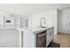 Kitchen featuring a center island with seating and stainless steel appliances at 8724 Scalpay St, Las Vegas, NV 89166