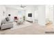 Cozy living room staged with modern furniture, a flat screen TV, and neutral decor at 8724 Scalpay St, Las Vegas, NV 89166