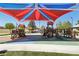 Community playground with slides and shade canopy, perfect for  at 8724 Scalpay St, Las Vegas, NV 89166