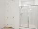 Modern bathroom with glass-enclosed shower and door for easy access at 8724 Scalpay St, Las Vegas, NV 89166