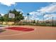 Community basketball court featuring a red-accented key and views of well-kept landscaping at 9215 Penn Station St, Las Vegas, NV 89123