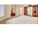 Bedroom featuring a decorative headboard, wardrobe, carpeted floors and neutral walls at 9215 Penn Station St, Las Vegas, NV 89123