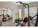 Bright exercise room with mirrored closet doors and modern workout equipment at 9215 Penn Station St, Las Vegas, NV 89123