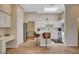 Bright kitchen featuring white cabinetry, a skylight, an island, and stainless steel appliances at 9215 Penn Station St, Las Vegas, NV 89123