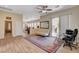 Comfortable living space featuring wood flooring, patio access, and ample natural light at 9215 Penn Station St, Las Vegas, NV 89123