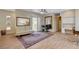 Living area featuring wood flooring, access to the outdoor patio, and neutral tones at 9215 Penn Station St, Las Vegas, NV 89123