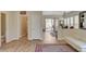 Open-concept living space with wood flooring, plenty of natural light and easy kitchen access at 9215 Penn Station St, Las Vegas, NV 89123