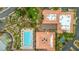 Aerial view of the community pool, building rooftops, and lush landscaping at 9409 January Dr, Las Vegas, NV 89134