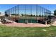 Fenced in baseball field with covered dugouts, bleachers, and well-maintained outfield at 9409 January Dr, Las Vegas, NV 89134
