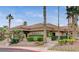 Community clubhouse with desert landscaping, ample shrubbery, and a tile roof at 9409 January Dr, Las Vegas, NV 89134