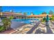Expansive community pool surrounded by lush landscaping and comfortable seating areas at 9409 January Dr, Las Vegas, NV 89134