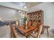 Elegant dining room with a chandelier, large table, seating for eight, and china cabinet at 9409 January Dr, Las Vegas, NV 89134