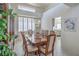 Elegant dining room with a chandelier, a large table, and seating for eight at 9409 January Dr, Las Vegas, NV 89134