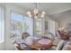 Cozy dining nook with bright windows overlooking the landscape at 9409 January Dr, Las Vegas, NV 89134