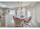 Cozy dining nook with bright windows overlooking the landscape at 9409 January Dr, Las Vegas, NV 89134