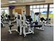 Bright fitness center with modern cardio and weight training equipment and floor-to-ceiling windows at 9409 January Dr, Las Vegas, NV 89134