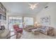 Bright living room featuring high ceilings, tile floors, and comfortable seating at 9409 January Dr, Las Vegas, NV 89134