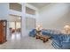 Bright and airy living room with high ceilings, tile flooring, and lots of natural light at 9409 January Dr, Las Vegas, NV 89134