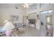 Bright living room featuring high ceilings, tile floors, and comfortable seating at 9409 January Dr, Las Vegas, NV 89134