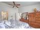 Main bedroom featuring carpet floors, a ceiling fan, and an ensuite bathroom at 9409 January Dr, Las Vegas, NV 89134