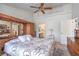 Large main bedroom featuring carpet floors, a ceiling fan, and light from a window at 9409 January Dr, Las Vegas, NV 89134