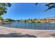 Scenic view of a community pond with walking path and beautiful landscaping at 9409 January Dr, Las Vegas, NV 89134