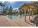 Community shuffleboard area with covered benches and mature landscaping around the perimeter at 9409 January Dr, Las Vegas, NV 89134