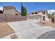 Two-story home featuring a three-car garage and a low-maintenance desert-landscaped yard at 9516 Belgate Ct, Las Vegas, NV 89129
