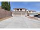 Two-story home features a wide driveway and large two-car garage at 9516 Belgate Ct, Las Vegas, NV 89129