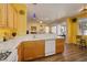 Well-equipped kitchen boasts ample counter space and natural light with seamless flow to living area at 9516 Belgate Ct, Las Vegas, NV 89129