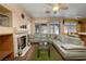 Cozy living room featuring a fireplace, hardwood floors, and bright natural light at 9516 Belgate Ct, Las Vegas, NV 89129
