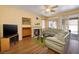 Living room with hardwood floors, fireplace, and access to the outdoor pool area at 9516 Belgate Ct, Las Vegas, NV 89129