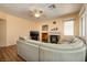 Inviting living room features a cozy fireplace and comfortable seating arrangement, and ceiling fan at 9516 Belgate Ct, Las Vegas, NV 89129