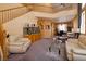 Open living room with high ceilings, a staircase, plush seating, and a dining area at 9516 Belgate Ct, Las Vegas, NV 89129
