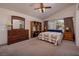 Spacious primary bedroom with a large dresser, bookcase, and a comfortable bed at 9516 Belgate Ct, Las Vegas, NV 89129
