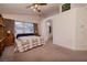 Bright primary bedroom with a comfortable bed, dresser, and natural light from windows at 9516 Belgate Ct, Las Vegas, NV 89129