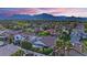 Expansive community view featuring lush greenery, mountain views, and red-tiled rooftops at 9705 Cameo Rose Ln, Las Vegas, NV 89134