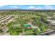 Community aerial view showcasing expansive green spaces, baseball fields, and residential area at 9705 Cameo Rose Ln, Las Vegas, NV 89134
