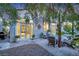 Cozy back patio featuring stone pavers, comfortable seating, and a charming garden at 9705 Cameo Rose Ln, Las Vegas, NV 89134