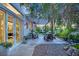 Relaxing outdoor patio with comfortable seating, pergola, and serene garden view at 9705 Cameo Rose Ln, Las Vegas, NV 89134