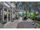 Well-manicured backyard features a pergola-covered patio with seating and natural stone landscaping at 9705 Cameo Rose Ln, Las Vegas, NV 89134