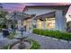 Charming backyard with a pergola, fountain, and stone pavers, perfect for outdoor lounging at 9705 Cameo Rose Ln, Las Vegas, NV 89134