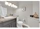 Half bathroom features modern lighting, neutral paint, and a clean aesthetic at 9705 Cameo Rose Ln, Las Vegas, NV 89134
