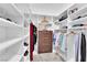 Walk-in closet featuring custom shelving and storage, providing ample space at 9705 Cameo Rose Ln, Las Vegas, NV 89134