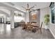 Elegant dining room with a large dining table, fireplace, custom built-ins, and modern lighting fixtures at 9705 Cameo Rose Ln, Las Vegas, NV 89134
