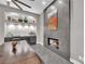 Elegant dining room with a modern fireplace and wine storage, perfect for entertaining at 9705 Cameo Rose Ln, Las Vegas, NV 89134