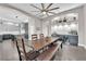 Bright dining area featuring a large wooden table, built-in cabinetry, and seamless flow to the adjacent kitchen space at 9705 Cameo Rose Ln, Las Vegas, NV 89134