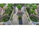Elegant gated community entrance with lush landscaping and manicured grounds at 9705 Cameo Rose Ln, Las Vegas, NV 89134