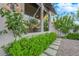 Charming home exterior featuring lush landscaping and a flower garden at 9705 Cameo Rose Ln, Las Vegas, NV 89134
