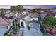 Charming two-story home with manicured landscaping, a tile roof, and a two-car garage at 9705 Cameo Rose Ln, Las Vegas, NV 89134